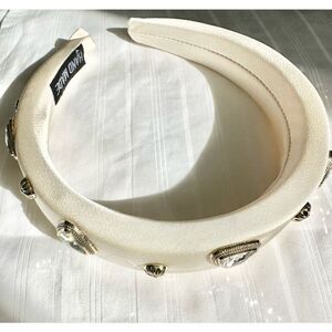 Off white headband with gold and rhinestone embellishment